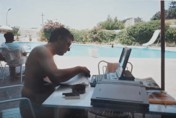 Co-founder of Antea sits poolside in the sun in the early 90s, with a computer on his poolside table, engineering the company's mechanical integrity software.
